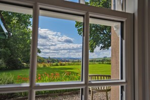 South facing panoramic view of the garden from the sitting room to the hills