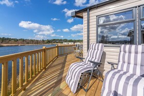 Avocet 28, Wells-next-the-Sea: The south-facing terrace is a lovely spot for sunbathing ...