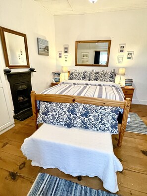 Back bedroom with garden, country and distant sea views. Double bed.