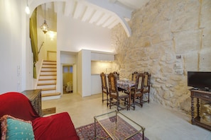 The dining area and kitchen. View of stairs (9 steps) to the upper bedroom.