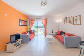 Spacious lounge leading out to terrace with sea views