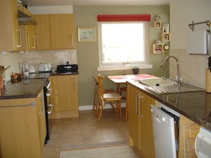 Kitchen with view into back garden