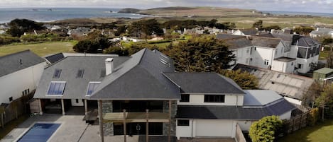 Drone view of Beach Boys showing Constantine Bay down the lane