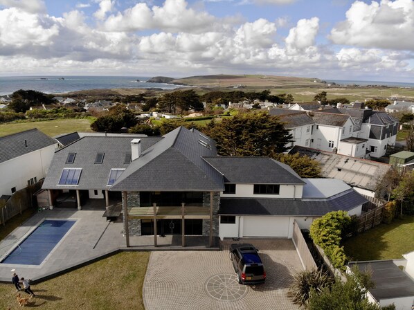 Drone view of Beach Boys showing Constantine Bay down the lane