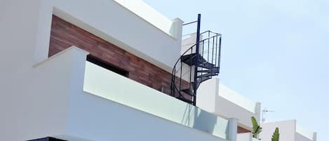 Rear of Villa Blanca showing the spiral staircase to the solarium