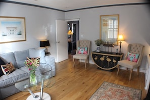 The living room is spacious and is newly and stylishly decorated and furnished