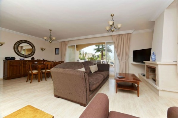 Living Room With Sliding Doors Onto Large Terrace