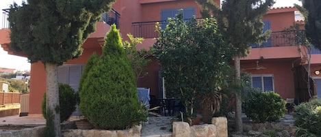 View of the outside, garden and patio.