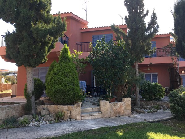 View of the outside, garden and patio.