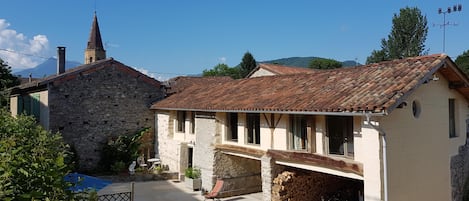 The barn showing front door on the left; the upper floor is bedroom/living space