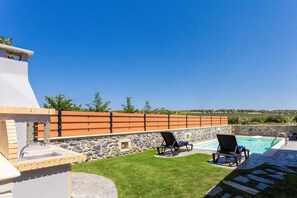 Garden area with private swimming pool and sun beds