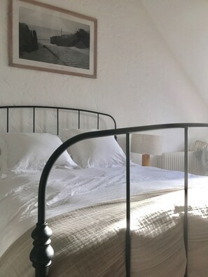 Master bedroom with glass mezzanine balcony and ensuite bathroom 