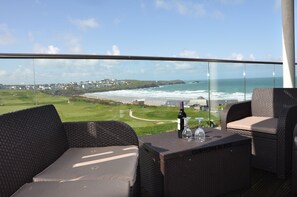 Balcony Furniture with Golf Course and Beach Behind