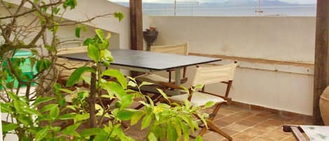 Large terrace with dining and seaview