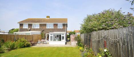 A sunny south-facing back garden, perfect for kids and eating outside... 