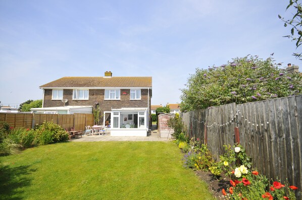 A sunny south-facing back garden, perfect for kids and eating outside... 