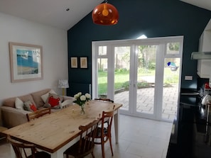 Large airy kitchen diner, doors opening on to the garden.