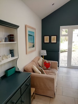 Comfy sofa in the airy kitchen.