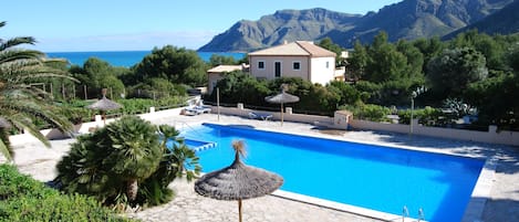 View from our home: Pool Area with a sea and mountain views.