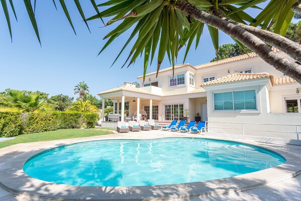 Luxury villa with pool and garden.