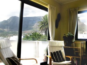 Living and dining room (view through sliding doors onto balcony).