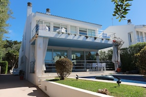 Front of the house with front terrace and pool