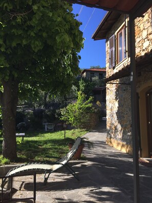 the house on the right with the terrace on the left