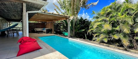 Large covered terrace with lounge and dining area