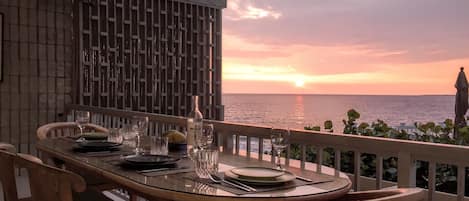 Sunset dining on the 200 sq ft lanai in May.  Season will affect sunset view