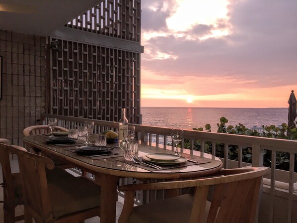 Sunset dining on the 200 sq ft lanai in May.  Season will affect sunset view