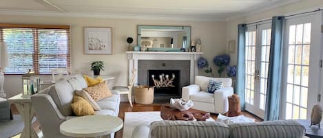 Large and bright living room, with working fireplace. 