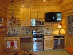 Kitchen boasts stainless appliances and an HDTV with satellite & DVD player.
