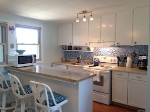 Bright sunny kitchen has been updated with new appliances