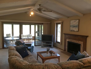 Family room, TV and screen porch.