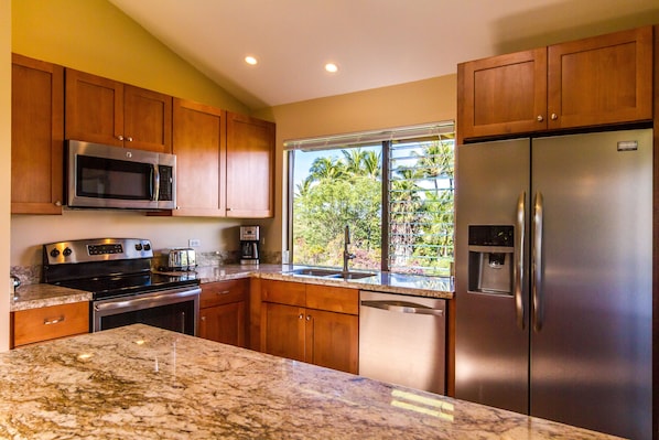 Updated & expanded kitchen with granite counters & stainless steel appliances
