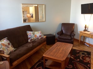 Living room with futon that sleeps 2.