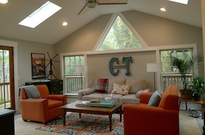The sun room is bright and airy - with a 49" TV