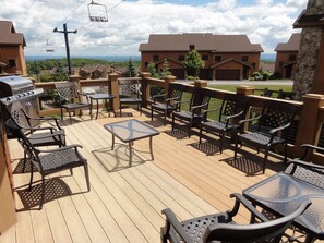 Expansive back deck with scenic mountaintop views.  Gas grill & seating for 10.