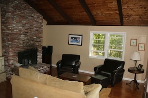 Living room with fireplace and view of lake (not shown)