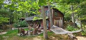 Firepit including firewood, gradual walk-in beach and hammock. 