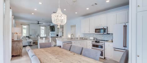 Open concept livingroom, kitchen, dining room brings families & friends together