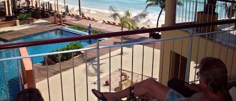 Enjoy Life from our balcony beautiful ocean and pool view and sunrises, too