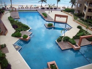 View of infinity pool boardwalk and beach