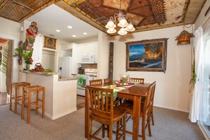 6 seater dining table.  Kitchen bar with 2 more chairs for additional seating.