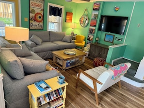 Main floor living area-Little leatherette sofa swings over for more seating