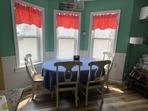 Dining seats six at the table, extra four with card table & chairs in closet