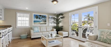 A taste of Aloha is splashed throughout this upper unit, with each room full of natural light, comfy-yet-stylish furnishings, and all the fixin's for a relaxing beach getaway.