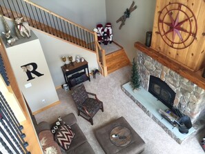 Living room, fire place and stairs
 from loft 