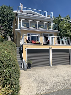 Stairs on the left lead up to the suite's entrance & Parking for 1 car 