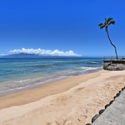 Sandy beach in front of complex